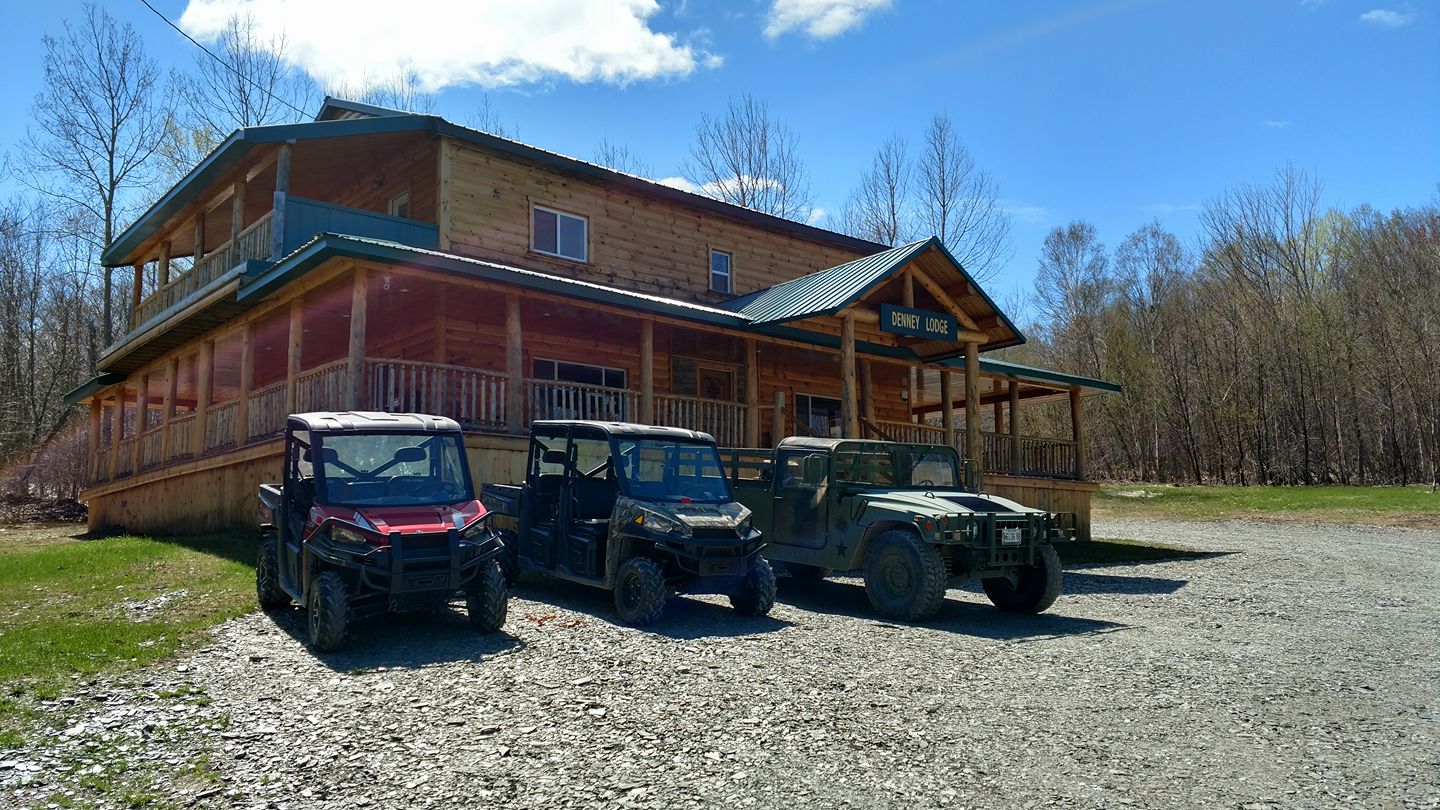 denney lodge with ATVs out front